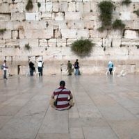 WESTERN WALL, JERUSALEM. Photographer Edgar Asher comments: Look for the unusual in a setting. The Kotel is normally full of people, but here a youth sits alone and contemplates. The composition takes the eye from the lone worshipper to the ancient stone walls.