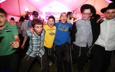 Having fun at previous Chanukah celebrations. Photo: Peter Haskin