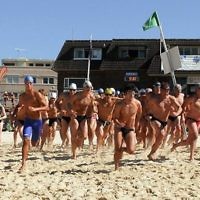 More than 60 competitors head for the water at Bondi Beach for the ocean swim event. Photo: Henry Benjamin.