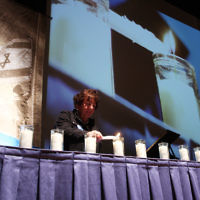Yom Hazikaron 2011. Robert Blackwood Hall, Monash University. Vivienne Sokol lights a candle in memory of Elyahu Slonim. Photo: Peter Haskin
