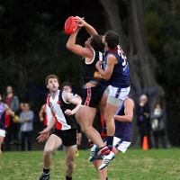27-8-11. AJAX v Old Essendon. Jason Seidl with Jake Lew looking on. Photo: Peter Haskin