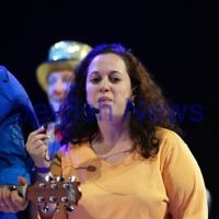 2-12-11. The Wiggles. Tammy Cohen on stage with the Wiggles at the Flemington racecourse in Melbourne singing "Fruit Salad". Tammy won a competition to be the 5th Wiggle. Photo: Peter Haskin