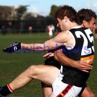 21-7-212. AJAX v Old Brighton at Brighton Beach Oval. Jake Lew being tackled after taking a shot at goal. Photo: Peter Haskin