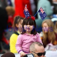22-8-12. A packed Federation Square in Melbourne welcomes home Australia's medalists from the London 2012 Olympics. One of the yunger fans showing her support for the athletes. Photo: Peter Haskin