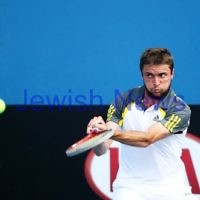 Australian Open 2013. Round 2. Jesse Levine (CAN) lost to  Gilles Simon (FRA) (14) 2-6 6-3 7-6 6-2.  Simon.   Photo: Peter Haskin