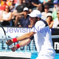 Australian Open 2013. Round 2, Mens Doubles.  Jonathan Erlich (ISR) / Kevin Anderson (RSA) def Matthew barton (AUS / John Millman (AUS) 6-1 6-7 6-3 Photo: Peter Haskin
