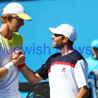 Australian Open 2013. Round 2, Mens Doubles.  Jonathan Erlich (ISR) / Kevin Anderson (RSA) def Matthew barton (AUS / John Millman (AUS) 6-1 6-7 6-3 Photo: Peter Haskin
