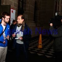 16-9-13. State Library of Victoria. Lecture by Richard Falk on " Human Rights in the Occupied Palestinian Territories". David Shulberg (right) discusses Middel East poitics with a member of the public on the steps of the State Library with tv station SBS news was filming. Photo: Peter Haskin