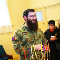 5-12-13. Last day of Chanukah. East Melbourne Hebrew Congregation. Rabbi David Gutnick, Jewish Chaplain with the Australian Defense Force, organised a candle lighting ceremony incorporating members of the ADF and guests that included Felix and Yvonne Sher, parents of Private Greg Sher who was killed in Afganistran. Photo: Peter Haskin 5-12-13. Last day of Chanukah. East Melbourne Hebrew Congregation. Rabbi David Gutnick, Jewish Chaplain with the Australian Defense Force, organised a candle lighting ceremony incorporating members of the ADF and guests that included Felix and Yvonne Sher, parents of Private Greg Sher who was killed in Afganistran. Photo: Peter Haskin
