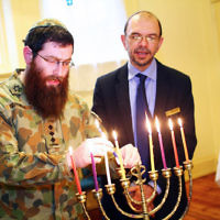 5-12-13. Last day of Chanukah. East Melbourne Hebrew Congregation. Rabbi David Gutnick, Jewish Chaplain with the Australian Defense Force, organised a candle lighting ceremony incorporating members of the ADF and guests that included Felix and Yvonne Sher, parents of Private Greg Sher who was killed in Afganistran. Photo: Peter Haskin 5-12-13. Last day of Chanukah. East Melbourne Hebrew Congregation. Rabbi David Gutnick, Jewish Chaplain with the Australian Defense Force, organised a candle lighting ceremony incorporating members of the ADF and guests that included Felix and Yvonne Sher, parents of Private Greg Sher who was killed in Afganistran. Photo: Peter Haskin