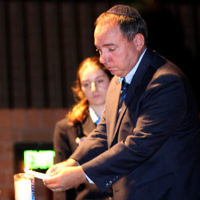 18-4-10. Yom Hazikaron. Robert Blackwood Hall, Monash University. Israeli Ambassador Yuval Rotem lights a memorial candle. photo: peter haskin 18-4-10. Yom Hazikaron. Robert Blackwood Hall, Monash University. Israeli Ambassador Yuval Rotem lights a memorial candle. photo: peter haskin