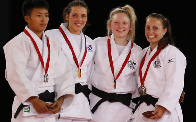 Amy Meyer (right) pictured with fellow judo medal-winners in the women’s under-48kg category in Glasgow, Scotland.
Photo: AP Photo/Frank Augstein