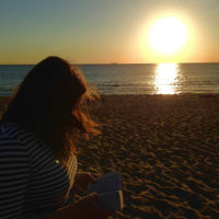 Devorah Adelist reads a prayer at Elwood beach, Melbourne in January 2015. Devorah Adelist reads a prayer at Elwood beach, Melbourne in January 2015.