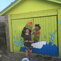 Elian Rothschild paints her grandfather's boatshed in Frankston (Victoria). Elian Rothschild paints her grandfather's boatshed in Frankston (Victoria).