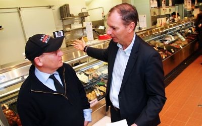 Eric Silver (left) of Solomon Kosher Butcher discussing the upcoming holiday with David Southwick. Photo: Peter Haskin