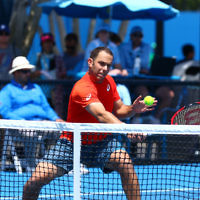23-1-16. Australian Open 2016. Day 6. Mens doubles round 2. Dominic Inglot (GBR) [11] Robert Lindstedt (SWE) [11] defeats Eric Butorac (USA) Scott Lipsky (USA) 7-6(5) 6-7(5) 6-4 . Photo: Peter HaskinCompleted Photo: Peter Haskin