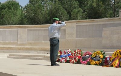 Israel Defence Forces’ Colonel Moshe Pinkert laying a wreath at the ceremony in Jerusalem.
