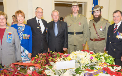 From left: VAJEX president Judy Landau, vice-president Julie Leder, Major General Jeffrey Rosenfeld, Squadron Leader Peter Meehan, bugler Tim Williams, chaplain Rabbi Dovid Gutnick and Major General Jim Barry.