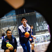 15-6-16. AFL multi cultural round. Members of Maccabi All Abilities working on their football skills at the Collingwood Footbal Club. Josh Ferenbach takes aim at the hand ball target. Photo: Peter Haskin