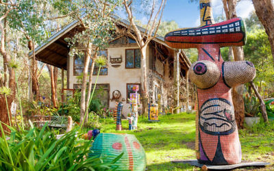 The gardens of Deborah Halpern’s Warrandyte home and studio are adorned with her work, including the imposing Bosom Woman (2004) in the foreground.