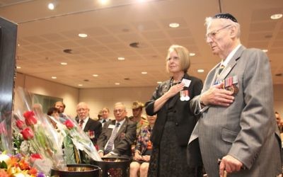Monica Kleinman and Brian Nebenzahl, representing NAJEX, pay their respects to our fallen. Photo: Shane Desiatnik