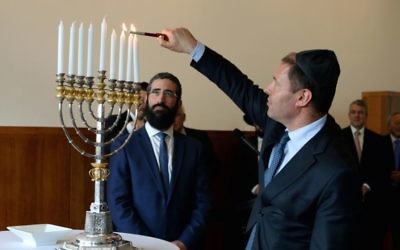 Josh Frydenberg MP lights an historic chanukiah at a Chanukah reception at Parliament House, Canberra.