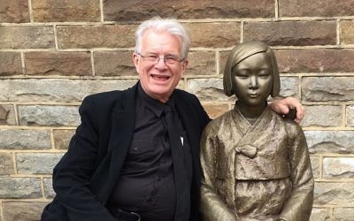 Reverend Bill Crews with the statue memorialising Korean sex slaves. Reverend Bill Crews with the statue memorialising Korean sex slaves.