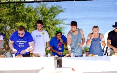 Contestants at the 2017 In One Voice bagel eating competition. Photo: Ren Rizzolo