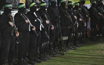 Fighters from Hamas's Ezz-Al Din Al Qassam Brigades at Monday's memorial service for Mazen Fuqaha. Photo: EPA/Mohammed Saber