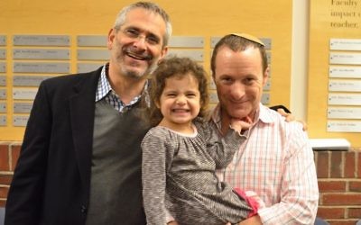 Rabbi Steve Greenberg (left) with his partner Steven Goldstein and their daughter.