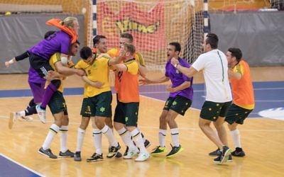 The Australian futsal team celebrating their last-minute victory over Brazil. Photo: Julie Kerbel