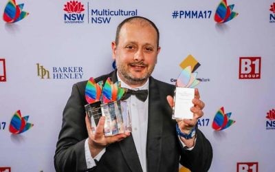 Noel Kessel with The AJN's three awards.
Photo: Salty Dingo Media.