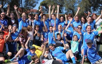 Maccabi Hakoah's ESFA women's division 2 team celebrates their grand final win with their children at Hensley Field on September 10. Photo: Shane Desiatnik