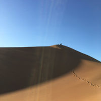 Jenny Lewin and daughter Jackie rest at the top of a sand dune in the Sahara Desert. Jenny Lewin and daughter Jackie rest at the top of a sand dune in the Sahara Desert.