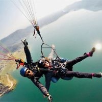 Anthony and Debby Zwi paragliding over Fewa Lake, Pokhara, Nepal.