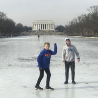 Tanya Kelly entered this photo of her sons on the frozen Lincoln Memorial Reflection Pool in Washington.