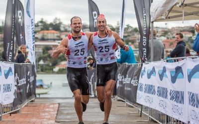 Ezechiel Orski-Ritchie (left) and teammate Jarred Shein approach the finish line. Photo: Paul Lemlin