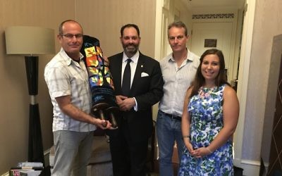 With the rejuvenated Sefer Torah, from left, Dvir Bar-Gal, Philip Dalidakis, Drew Nuland and Kehilat Shanghai's community coordinator Hannah Maia Frishberg.