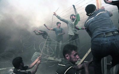 Palestinian demonstrators at the Israel–Gaza border last Friday. Photo: by Majdi Fathi/NurPhoto/Sipa USA
