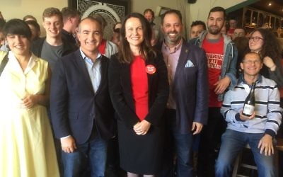 Surrounded by supporters at the launch, from left, Deputy Premier James Merlino, Caulfield candidate Sorina Grasso and Labor frontbencher Philip Dalidakis. Photo: Peter Kohn