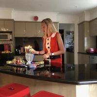 Michelle Sobel entered this photo of her daughter who came home from an end of year Christmas function dressed up as Santa and lit the Chanukiah.