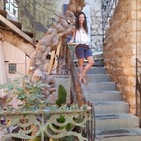 Sarah Ben-Simon at the old fig tree at Tsfat, Israel which is now part of the Artists Colony.