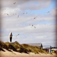 Yael Rothschild entered this photo of a Frankston man praying on the roof of his boat shed.