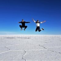 Iddo Snir and Rachel Flitman jumping at the Salt Flats, near Uyini, Bolivia