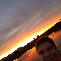 Ashley Morris taking a selfie at Shearwater Reserve at sunset.