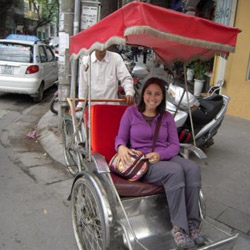 Sarah in a cyclo in Hanoi.
