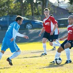 North Caulfield Maccabi's Henry Kazaryan (left) keeps his eye on the ball. Photo: Daniel Opat