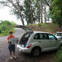 Gloria Allen, watched by a headless chicken, studies the road map in Hawaii. Photo entered by Peter Allen of Castle Cove, NSW. Gloria Allen, watched by a headless chicken, studies the road map in Hawaii. Photo entered by Peter Allen of Castle Cove, NSW.