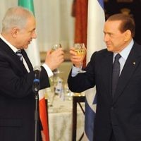 Italian Prime Minister Silvio Berlusconi and Israeli Prime Minister Binyamin Netanyahu drink a toast in Jerusalem on February 1. Photo: Isranet Italian Prime Minister Silvio Berlusconi and Israeli Prime Minister Binyamin Netanyahu drink a toast in Jerusalem on February 1. Photo: Isranet