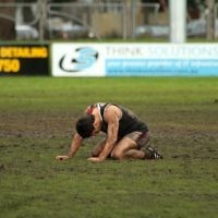5-9-10. AJAX v Beaumaris. 2nd Semi Final. A shattered AJAX player, Marcus Jankie, slumps to the ground after their 4 point loss. Photo: Peter Haskin. 5-9-10. AJAX v Beaumaris. 2nd Semi Final. A shattered AJAX player, Marcus Jankie, slumps to the ground after their 4 point loss. Photo: Peter Haskin.